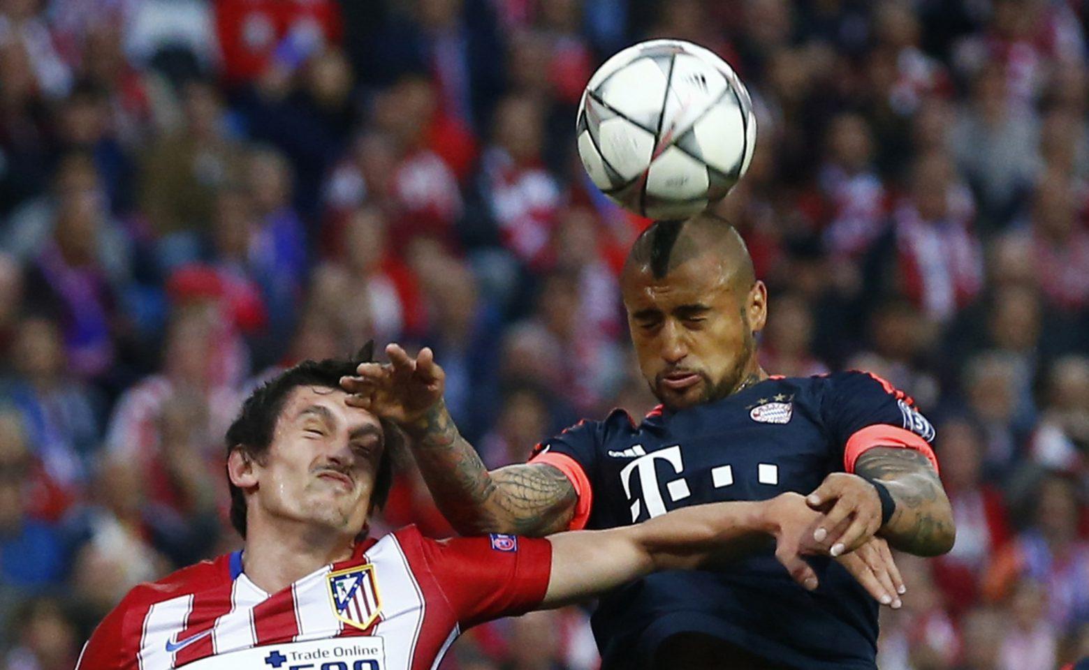 Football Soccer - Atletico Madrid v Bayern Munich - UEFA Champions League Semi Final First Leg - Vicente Calderon Stadium - 27/4/16 Bayern Munich's Arturo Vidal in action with Atletico Madrid's Stefan Savic Reuters / Michael Dalder Livepic EDITORIAL USE ONLY.