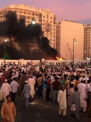 Muslim worshippers gather after a suicide bomber detonated a device near the security headquarters of the Prophet's Mosque in Medina, Saudi Arabia, July 4, 2016. REUTERS/Handout