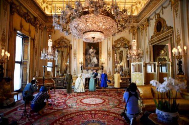 Exhibition curator Caroline de Guitar poses for photographers as she shows off a preview of an exhibition entitled 'Fashioning a Reign: 90 Years of Style from The Queen's Wardrobe,' charting the reign of Britain's Queen Elizabeth through a display of her formal and informal outfits, at Buckingham Palace, in central London, Britain July 4, 2016. REUTERS/Dylan Martinez