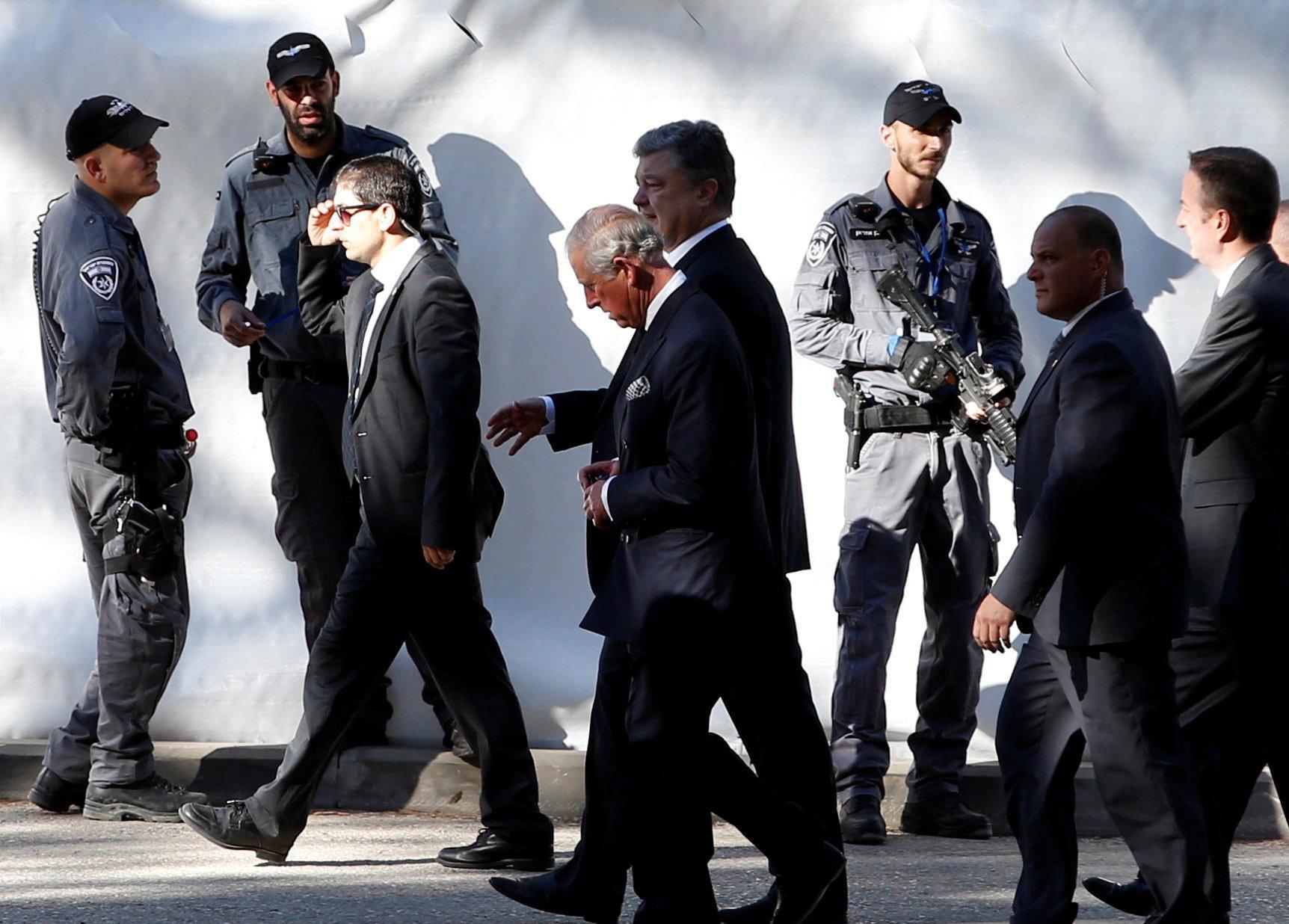 Britain's Prince Charles (C) is seen upon his arrival to Mount Herzl Cemetery to attend the funeral of former Israeli President Shimon Peres, in Jerusalem September 30, 2016. REUTERS/Ronen Zvulun
