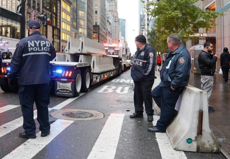Concrete barriers arrive for placement around Trump Tower, Wednesday Nov. 9, 2016, in New York. (AP Photo/Bebeto Matthews)